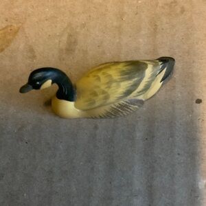 Yellow and Black Duck Figurine